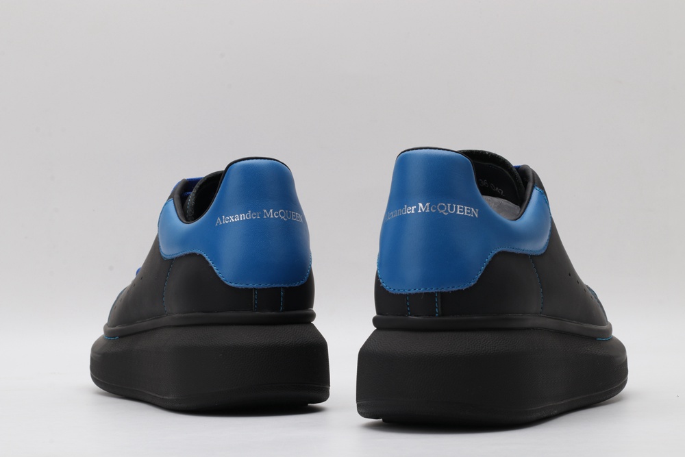 AMQ black oversized sneakers with blue heel
