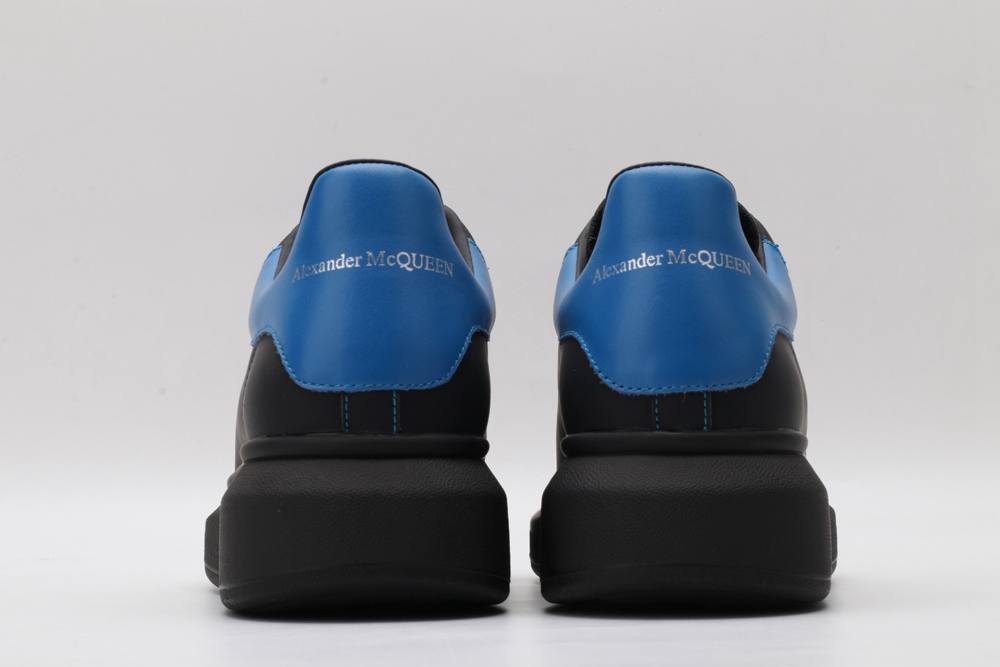 AMQ black oversized sneakers with blue heel