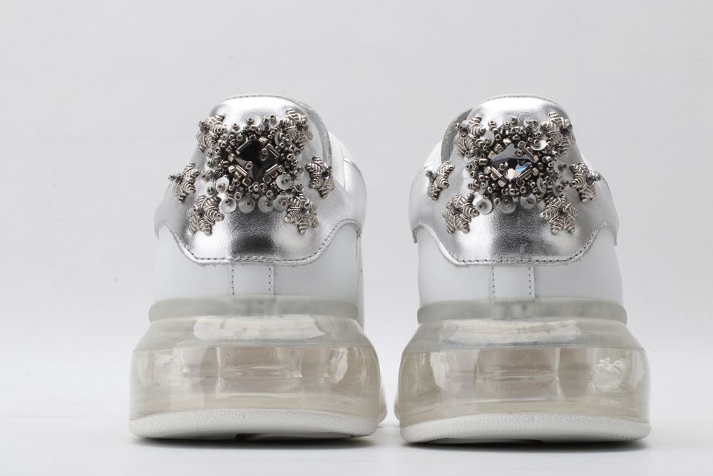 AMQ white oversized sneakers with siL*Ver heel