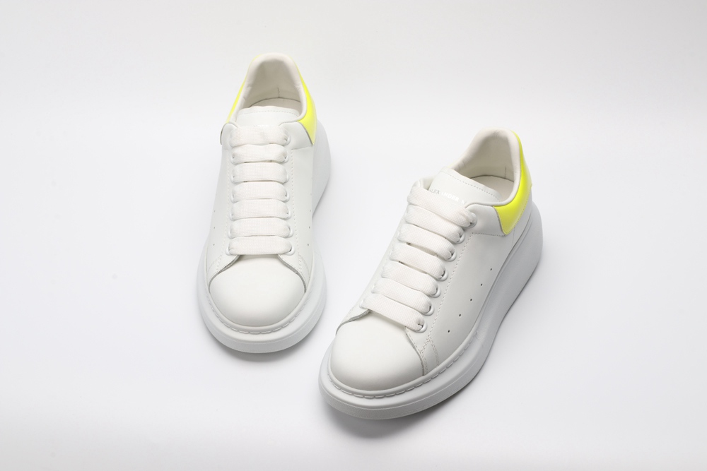 AMQ yellow foil embellished chunky leather sneakers