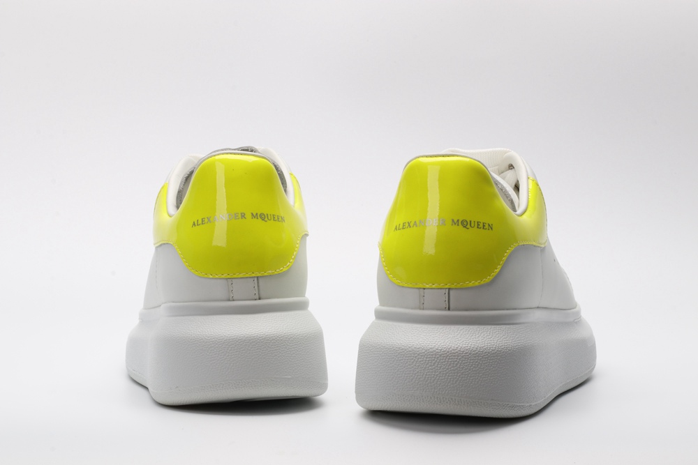 AMQ yellow foil embellished chunky leather sneakers