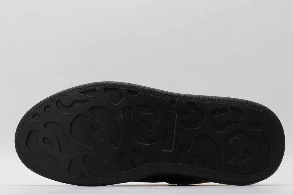 AMQ black oversized sneakers with gold heel