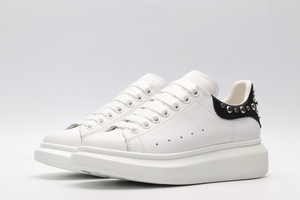 White calf leather lace-up sneaker trimmed with contrasting-color black calf leather heel