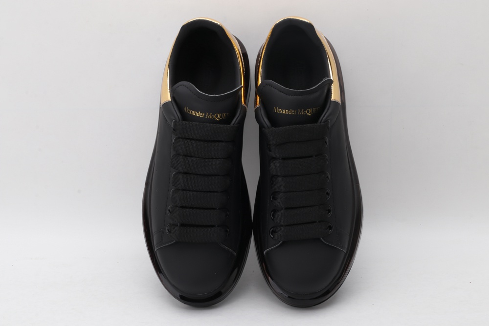 AMQ oversized sneakers black with gold heel