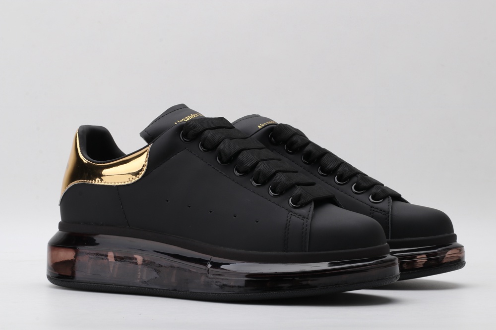AMQ oversized sneakers black with gold heel