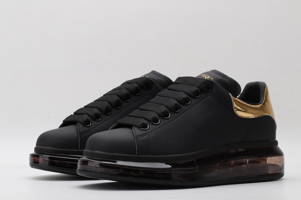 AMQ oversized sneakers black with gold heel