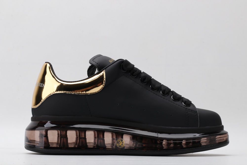 AMQ oversized sneakers black with gold heel