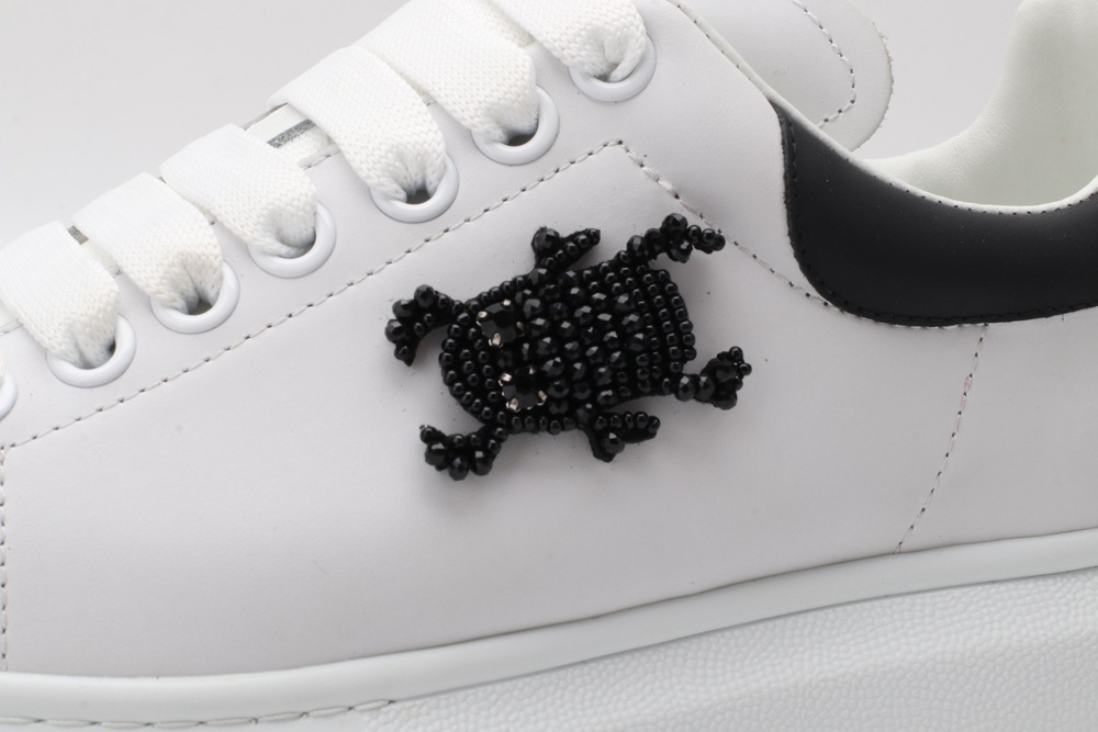 AMQ white oversized sneakers with black heel