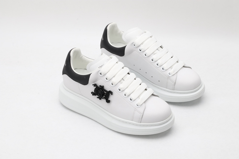 AMQ white oversized sneakers with black heel