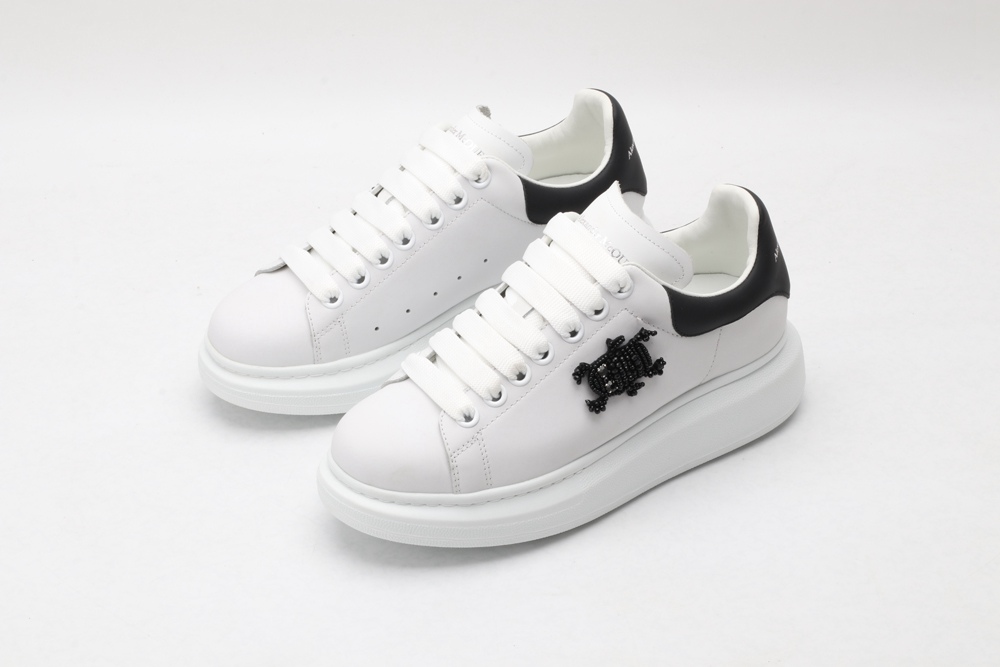 AMQ white oversized sneakers with black heel