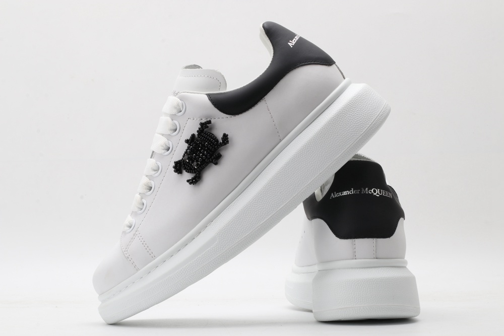 AMQ white oversized sneakers with black heel