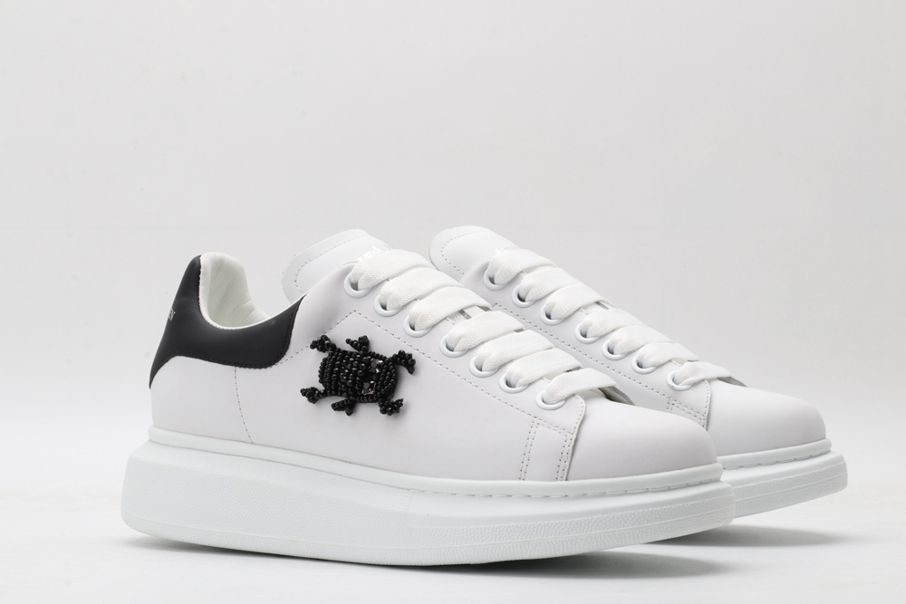 AMQ white oversized sneakers with black heel