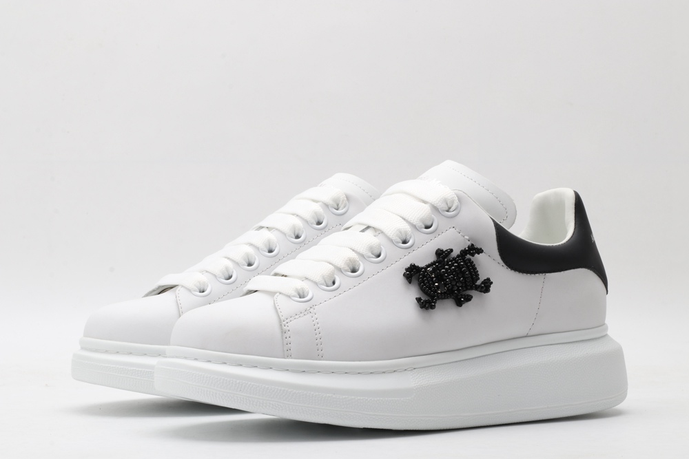 AMQ white oversized sneakers with black heel