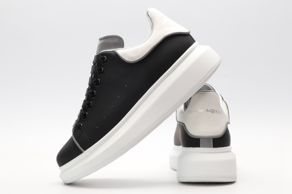 AMQ black oversized sneakers with siL*Ver heel