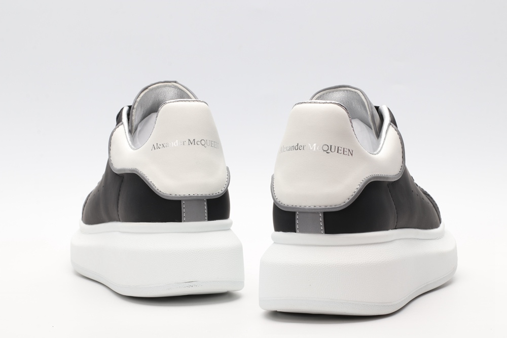 AMQ black oversized sneakers with siL*Ver heel