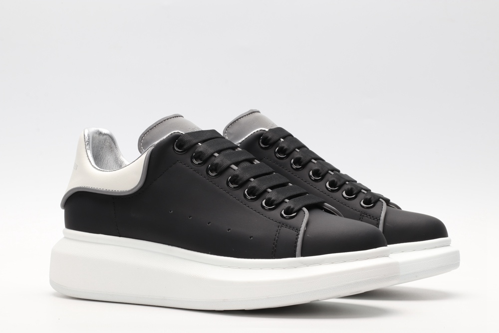 AMQ black oversized sneakers with siL*Ver heel