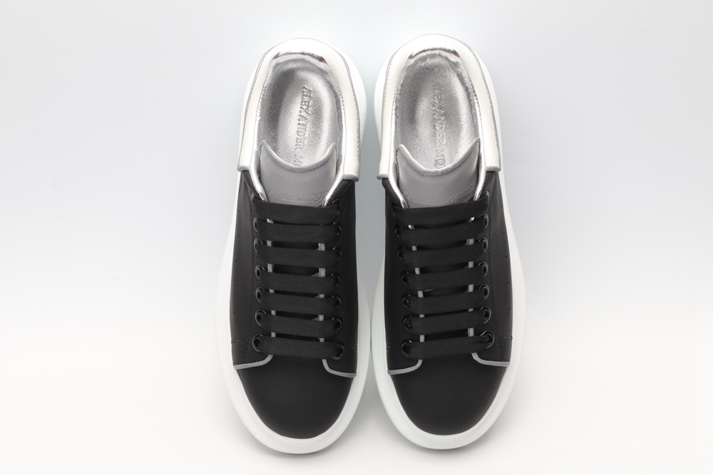 AMQ black oversized sneakers with siL*Ver heel