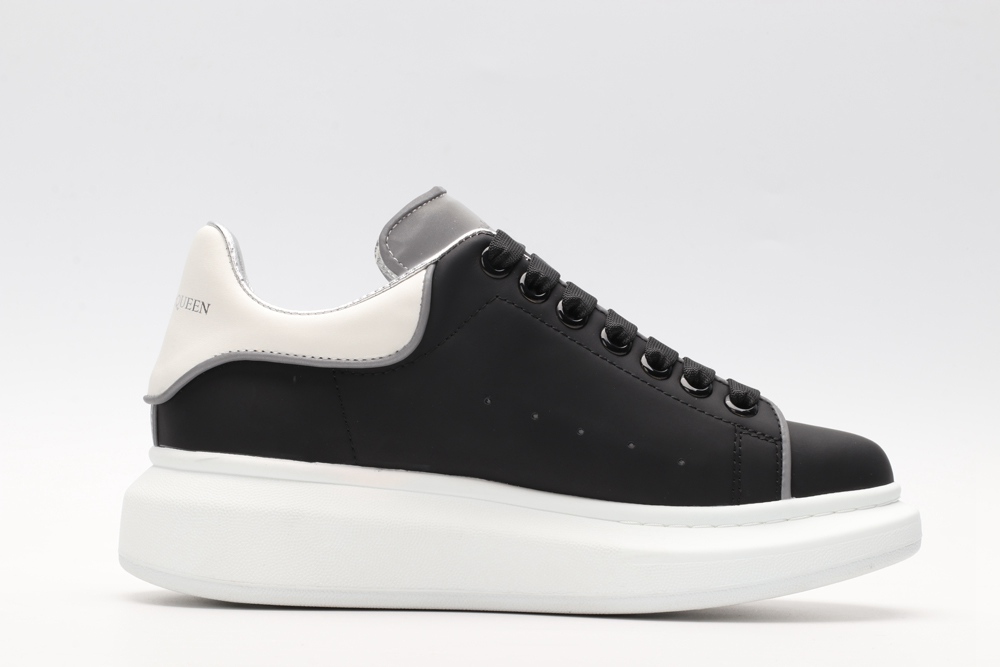 AMQ black oversized sneakers with siL*Ver heel