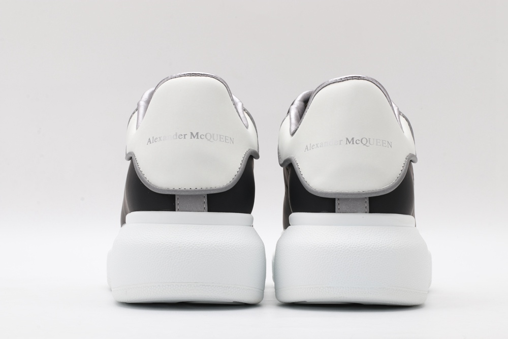 AMQ oversized black sneakers with white heel