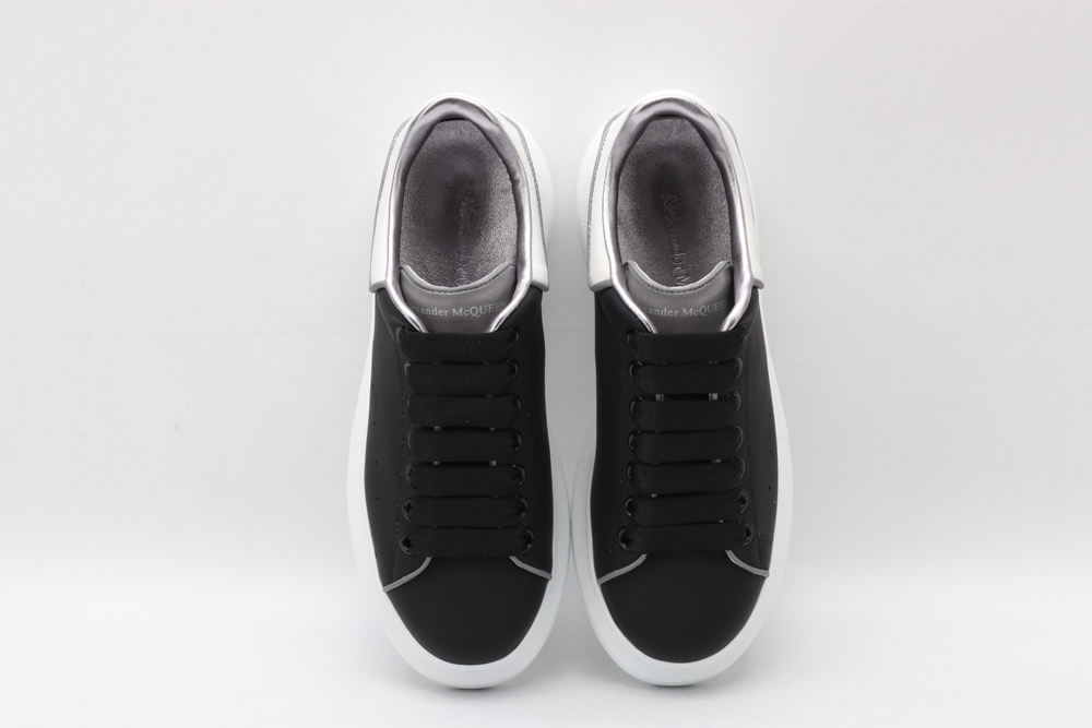 AMQ oversized black sneakers with white heel