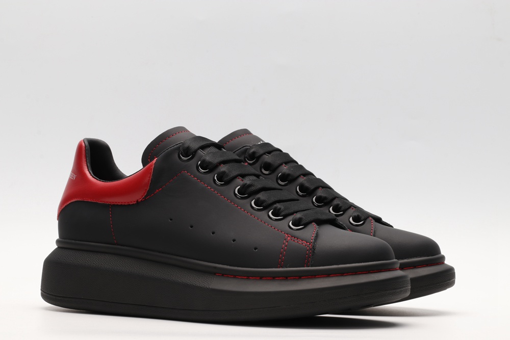 AMQ black oversized sneakers with red heel