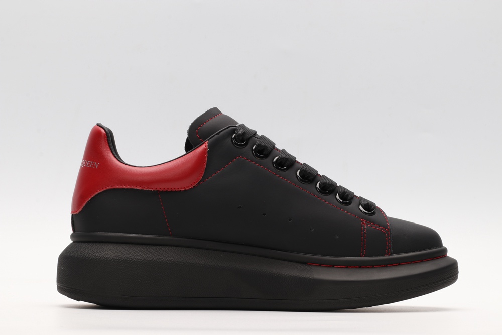 AMQ black oversized sneakers with red heel