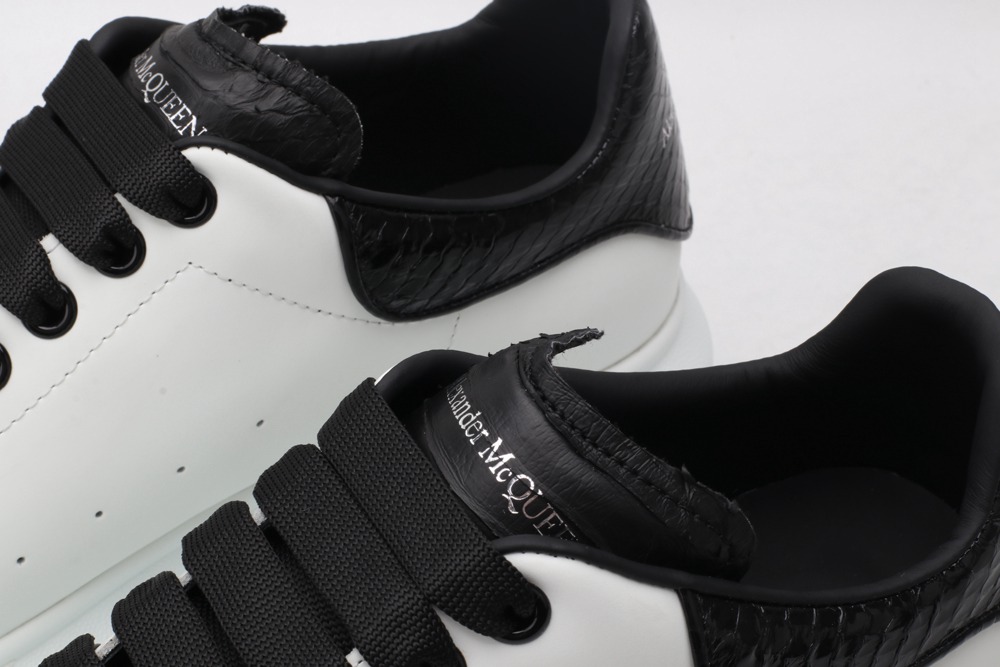 AMQ OVERSIZED SNEAKER with blue stamped python heel