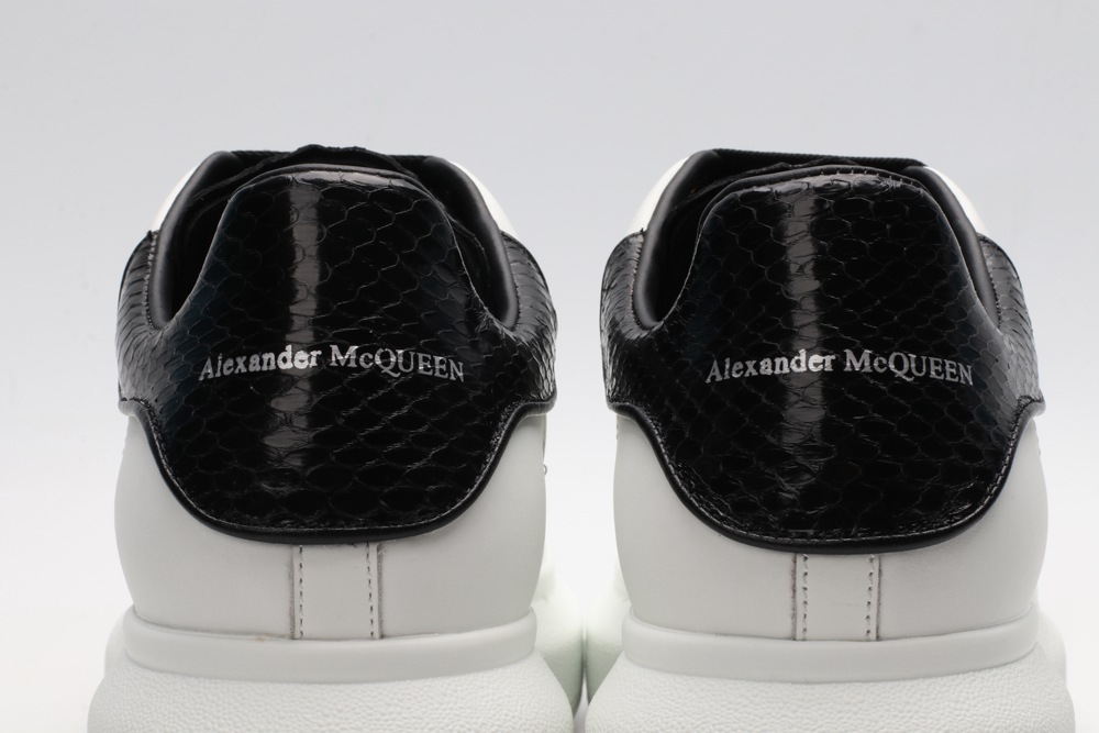 AMQ OVERSIZED SNEAKER with blue stamped python heel