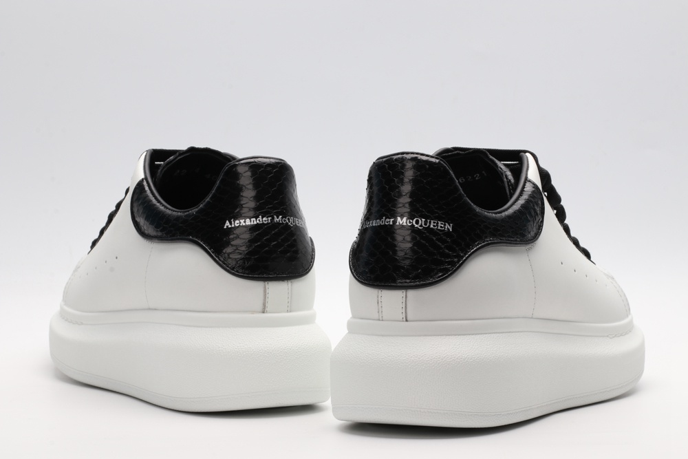 AMQ OVERSIZED SNEAKER with blue stamped python heel